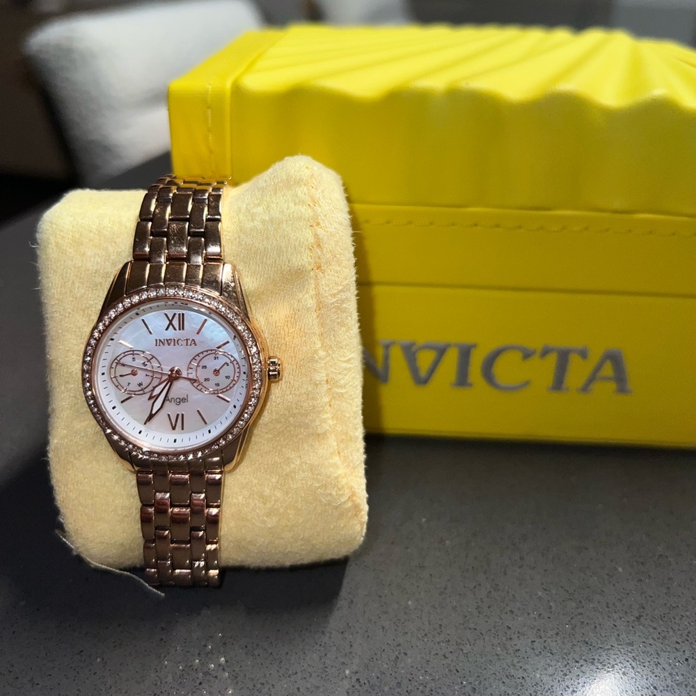 Rose Gold Angel Quartz Watch with rhinestones around the clock.